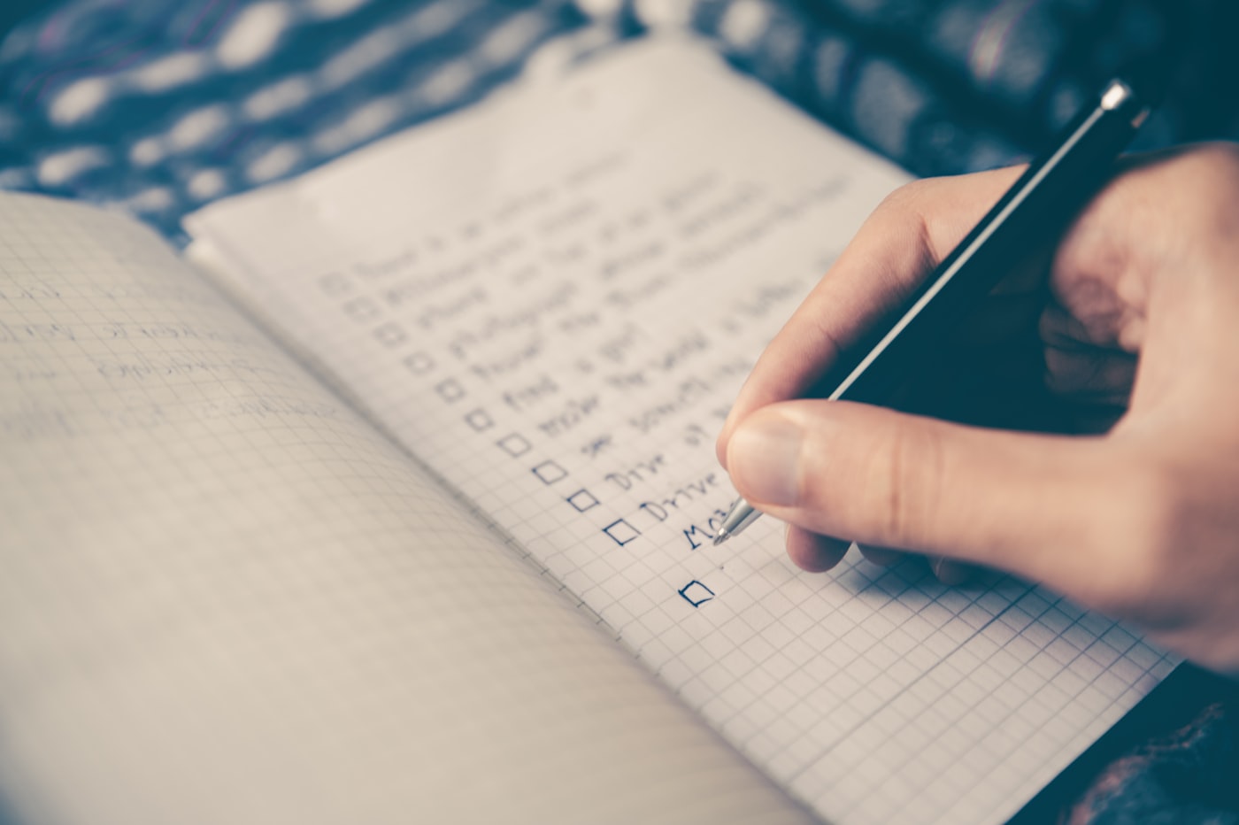 Open planner with a written checklist